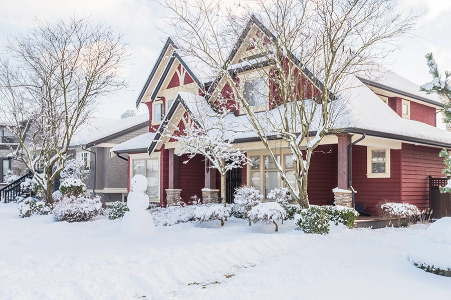 A snow covered home in Springfield, IL. The homeowners can benefit from HVAC service from Tarter Brothers Mechanical, Inc. to keep their home safe and warm during the winter months.