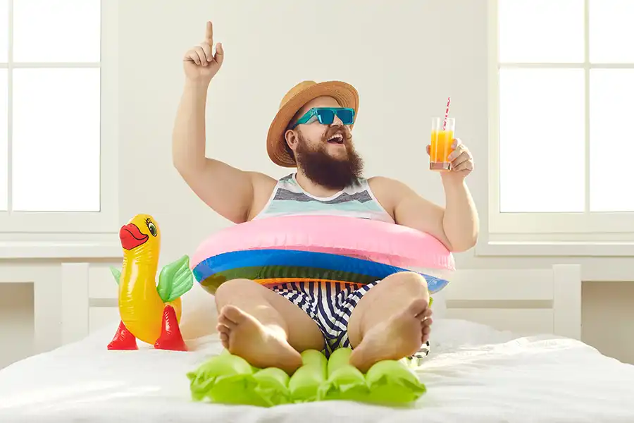 Tarter Brothers Mechanical, Inc.—A man dressed for the beach is inside his Central IL home enjoying the cool comfort of his AC.